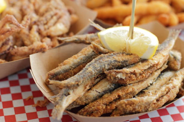 Fried anchovies typical of Spain, pescadito frito Fried anchovies with lemon typical of Spain, pescadito frito fried stock pictures, royalty-free photos & images