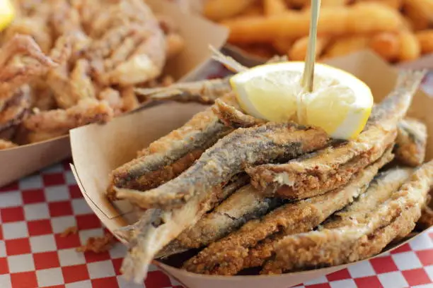 Fried anchovies with lemon typical of Spain, pescadito frito