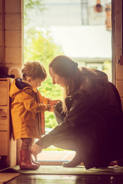 Good rainy day for a walk Family is going to walk under rain in autumn ready for rainy autumn day stock pictures, royalty-free photos & images
