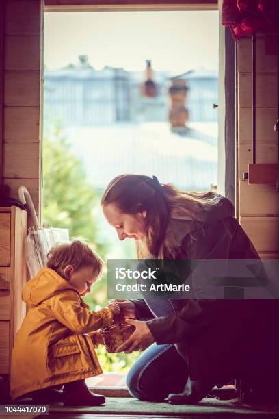 Good Rainy Day For A Walk Stock Photo - Download Image Now - Child, Getting Dressed, Boot