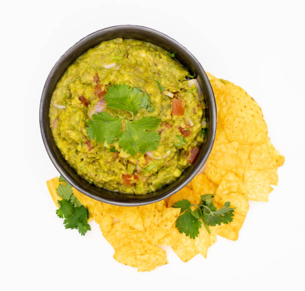 istock Guacamole Avocado with chips mexican food flat lay top view isolated 1044418068