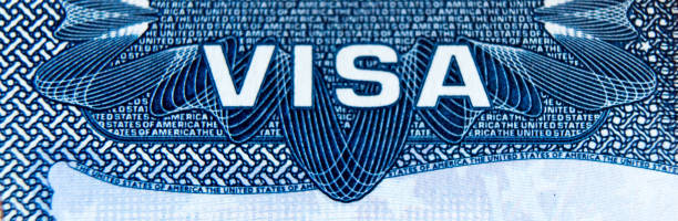istock Visa stamp travel passport immigration macro emigration 1044422334
