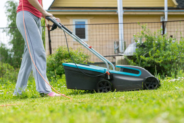 istock outdoor worker mowing the lawn 1044422504