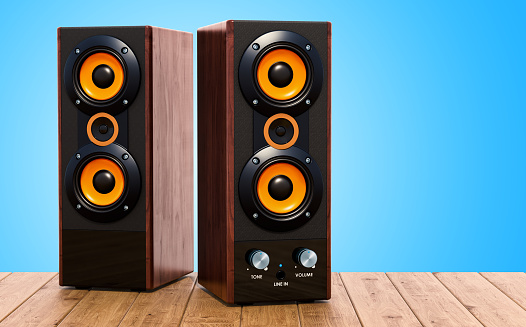 Computer Speakers on the wooden table, 3D rendering