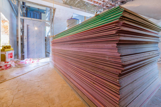 istock Construction materials and sheets of plasterboard or drywall are prepared for working process of installing  plasterboard -drywall -for making gypsum walls  in apartment is under construction, remodeling, renovation, extension, restoration and reconstruct 1044422932