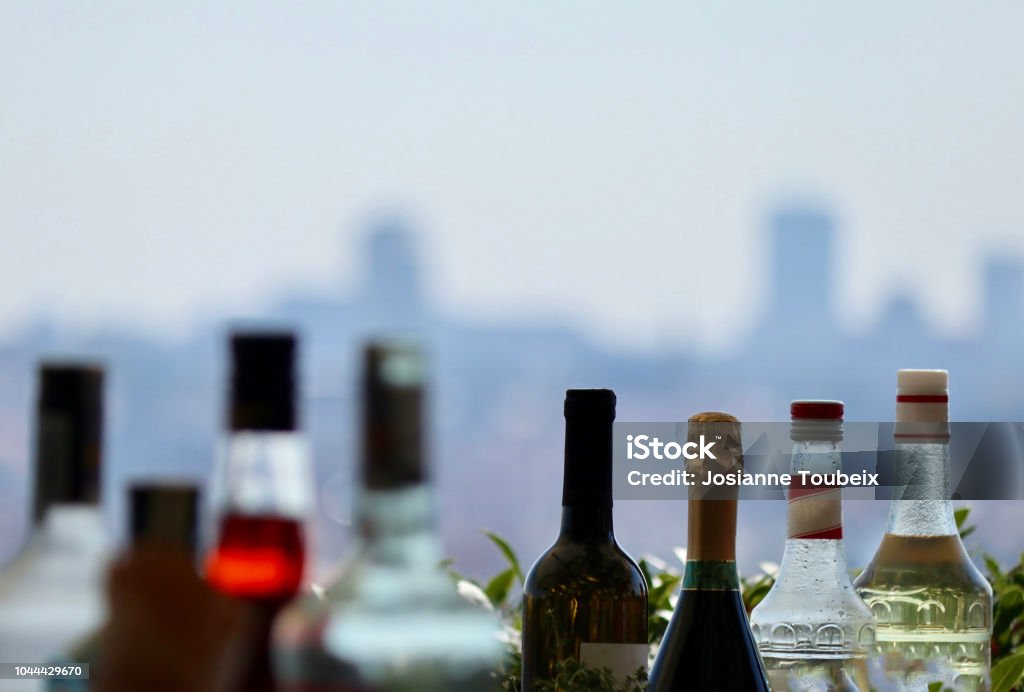 traffic congestion Bottles of alcohol online at an open-air bar in front of a series of buildings in downtown Prague, Czech Republic Bar - Drink Establishment Stock Photo