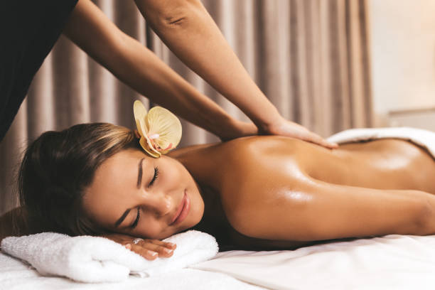 Massage Beautiful young woman relaxing with hand massage at beauty spa massaging stock pictures, royalty-free photos & images
