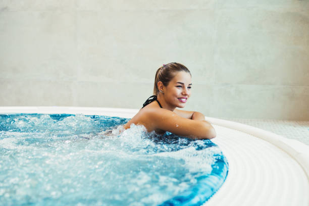 istock Woman in hot tub 1044432172