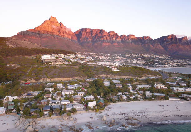 Clifton beach coastline, evening light on Table mountain Aerial view over Clifton beach, Cape Town, South Africa clifton stock pictures, royalty-free photos & images