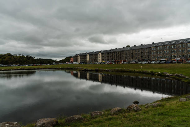 Westport, Ireland -- July 14, 2018. Shops, hotels and parking by Clew Bay in Westport