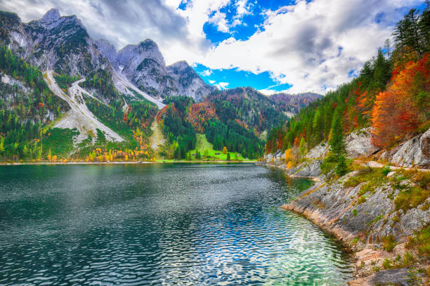 istock colorful autumn scenery with Dachstein mountain summit by Gosausee mountain lake 1044457066