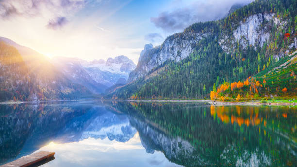 istock colorful autumn scenery with Dachstein mountain summit by Gosausee mountain lake 1044457072