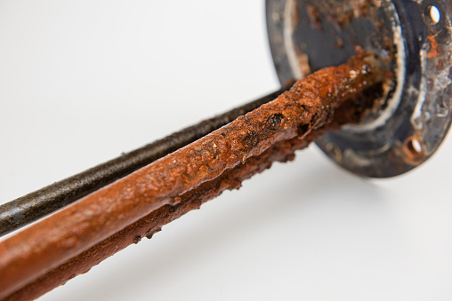 Stick water heater element look old isolated close up