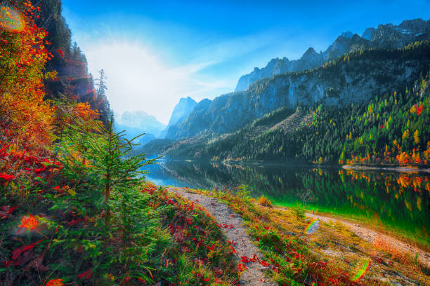 istock colorful autumn scenery with Dachstein mountain summit by Gosausee mountain lake 1044458596