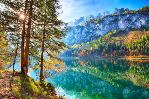 istock colorful autumn scenery with Dachstein mountain summit by Gosausee mountain lake 1044459832