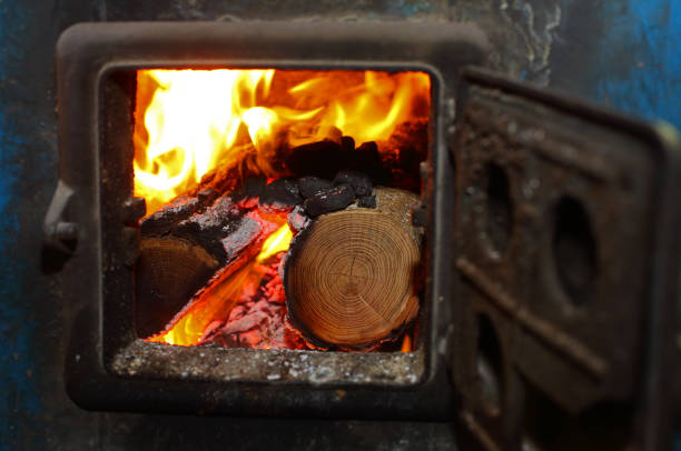 Open iron stove in boiler room