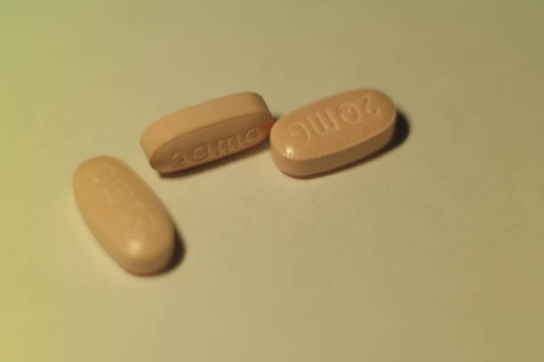 istock close up pink pill and medicine 1044463530