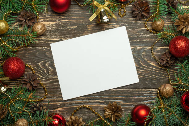 istock Creative layout made of Christmas tree branches with paper card note. Flat lay. Nature New Year concept. 1044464508