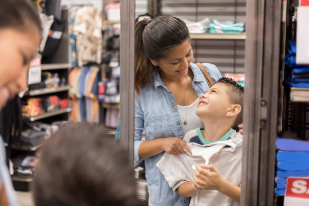 istock Cheerful mom enjoys shopping with her son 1044466674
