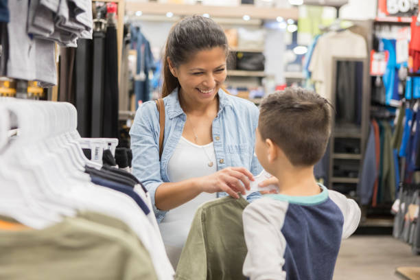 istock Mom shops for clothes for her son 1044466694