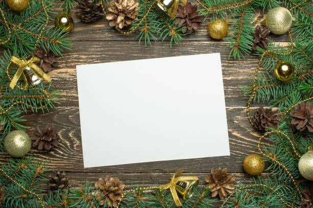 istock Creative layout made of Christmas tree branches with paper card note. Flat lay. Nature New Year concept. 1044466702