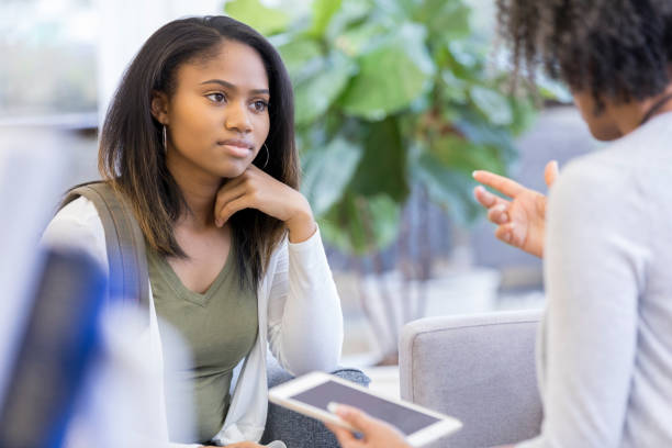 istock Attentive student talks with guidance counselor 1044468788