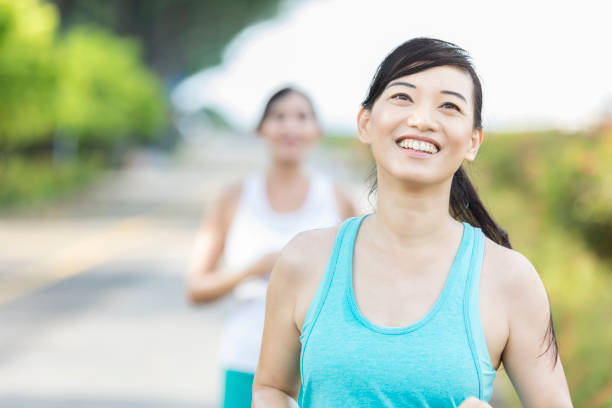 istock Happy woman smiles while running 1044468946