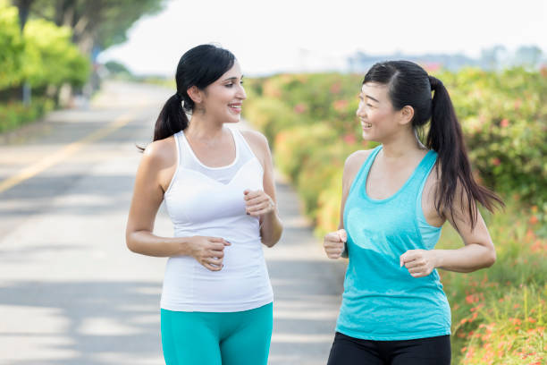 istock Female friends exercise together 1044468964