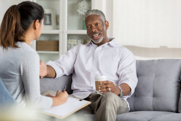 istock Man discusses something with female counselor 1044469200