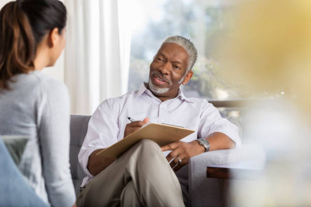istock Attentive counselor talks with patient 1044469238