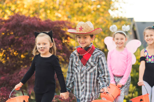 istock Multiethnic group of kids trick or treating 1044472264