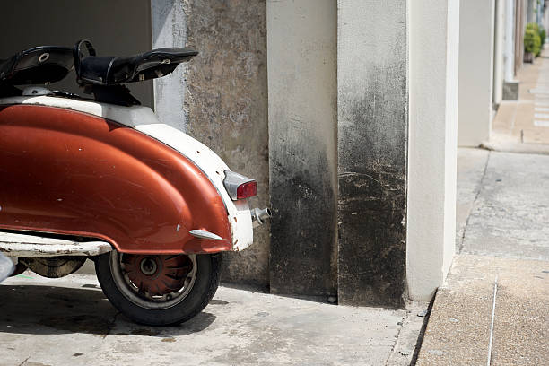 istock Classic Italian scooter parked by a battered wall 104447616