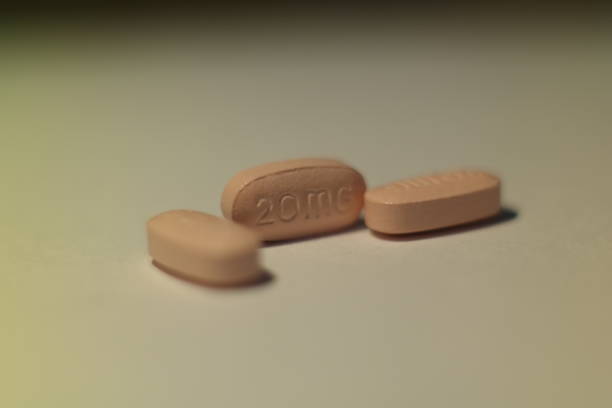 istock close up pink pill and medicine 1044480350