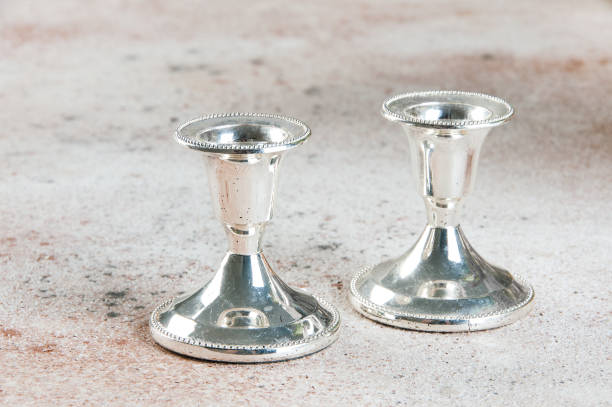 istock Vintage candlesticks on concrete background. 1044483182