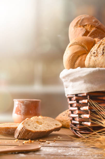 istock Assortment of breads over a wicker basket in kitchen vertical 1044492774