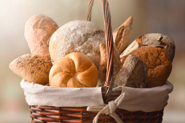 istock Assortment of breads over a wicker basket close up 1044492786