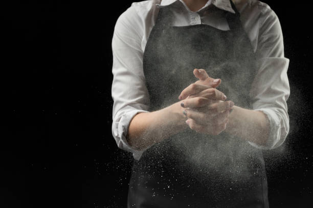 istock handmade cotton chef with mold flour on a black background 1044504124