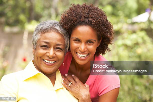 Senior Woman Hugging Adult Daughter Stock Photo - Download Image Now - Mother, Daughter, African-American Ethnicity
