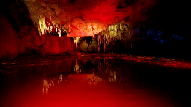 Water and stalagmites inside cave in Caucasian mountains in Kutaisi, Georgia