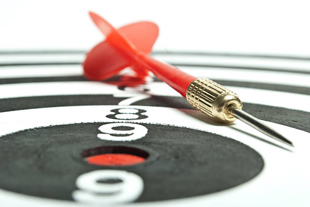 istock Darts laying on the dartboard 104451756