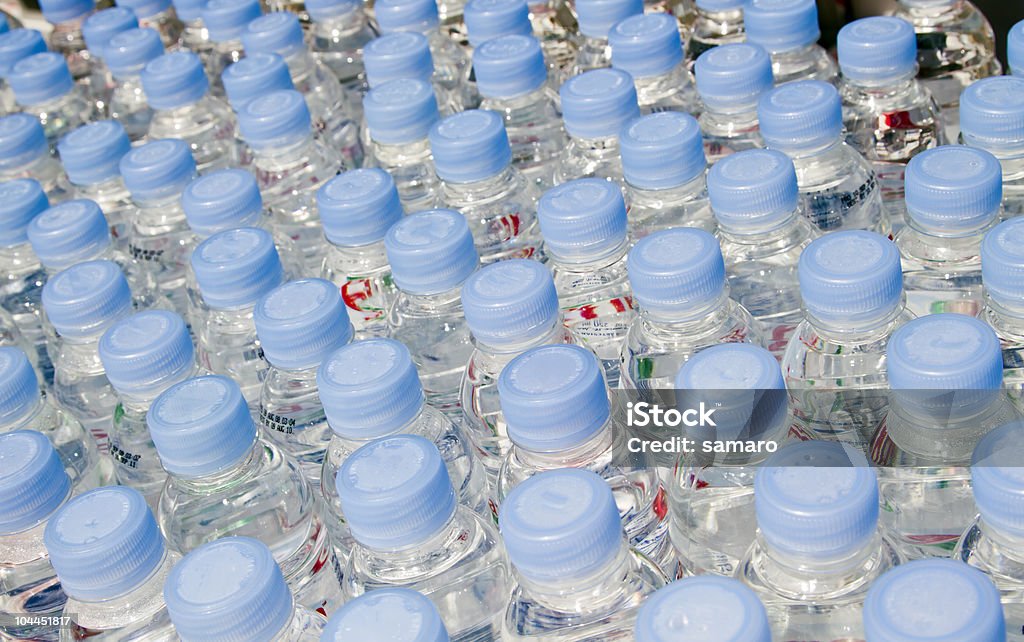 Bottled water Bottled spring water in the row. Abstract Stock Photo