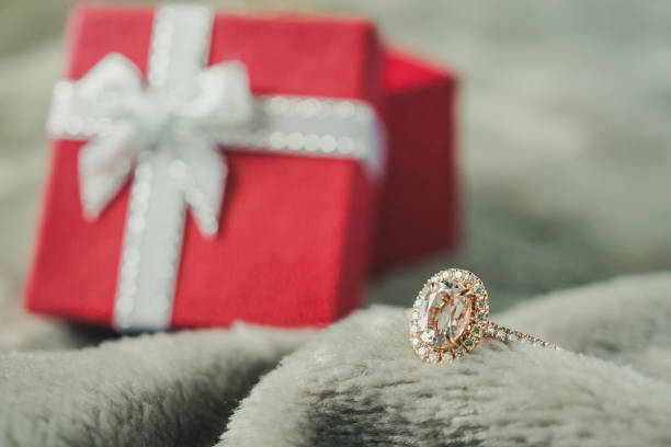 istock jewelry pink diamond ring with red gift box background 1044525992