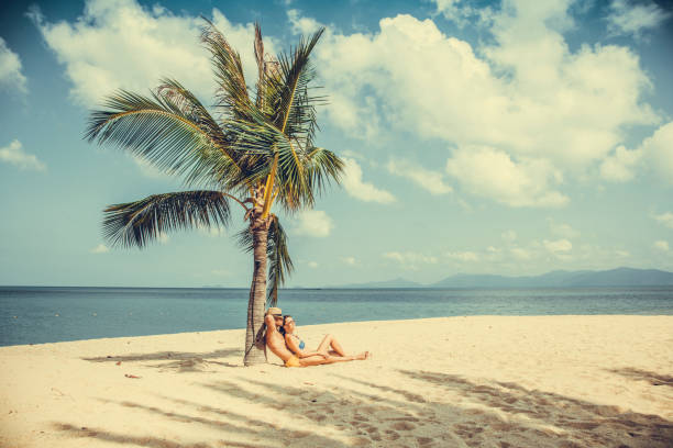 istock Couple on tropical beach 1044528036