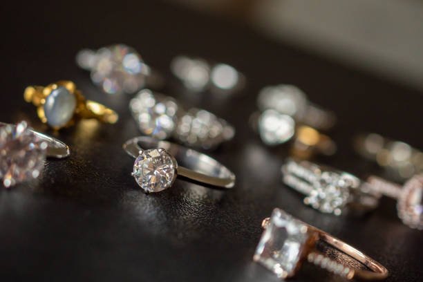 istock Jewelry diamond rings set on black background close up 1044528150