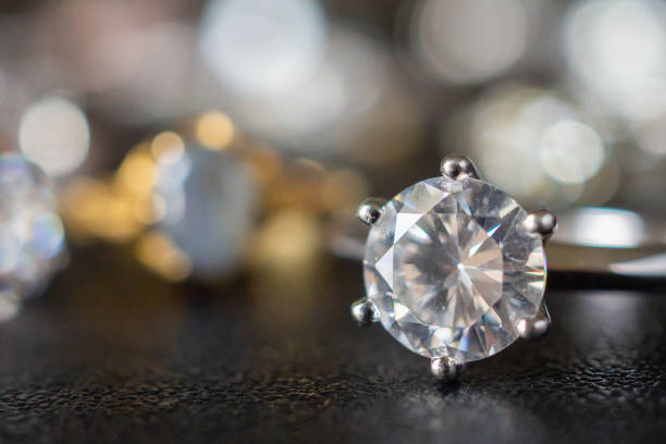 istock Jewelry diamond rings set on black background close up 1044528154