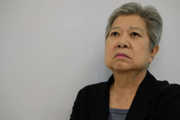istock old woman thinking. thoughtful pensive senior 1044528340