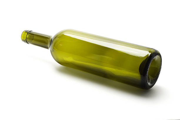 Empty wine bottle Empty wine bottle lying on white background bottle empty nobody glass stock pictures, royalty-free photos & images