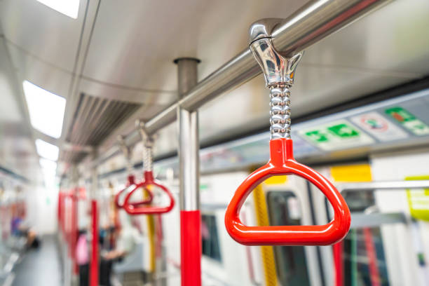 istock Red handrails in subway train 1044532524