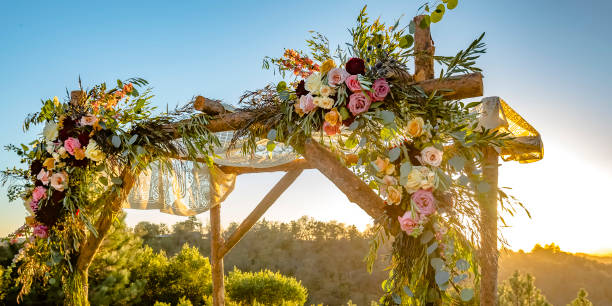 istock Chuppah with cascading flowers and lace cloth 1044535782