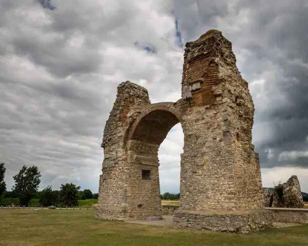 Photo of Heathens' Gate in Petronell Carnuntum on a stormy, cloudy day